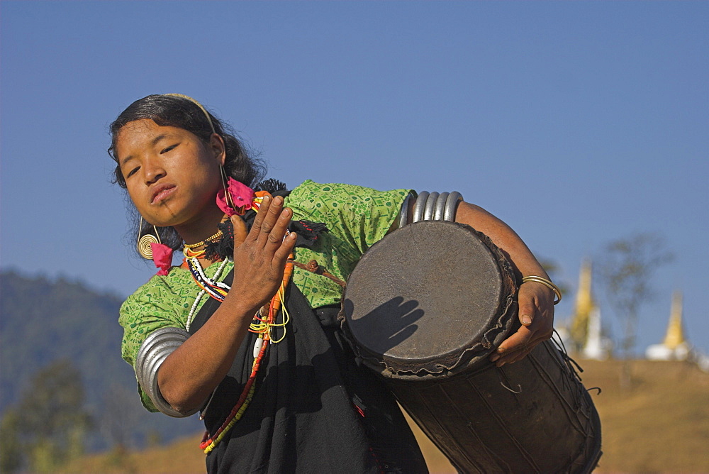 Naga lady dancing and playing, Naga New Year Festival, drum, Lahe village, Sagaing Division, Myanmar (Burma), Asia