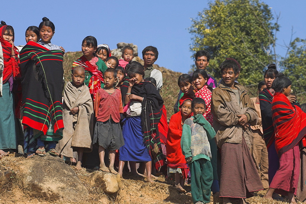 The Naga (Macham tribe) villagers looking at tourists seldom seen in the area, Magyan Village, Sagaing Division, 
Myanmar (Burma), Asia