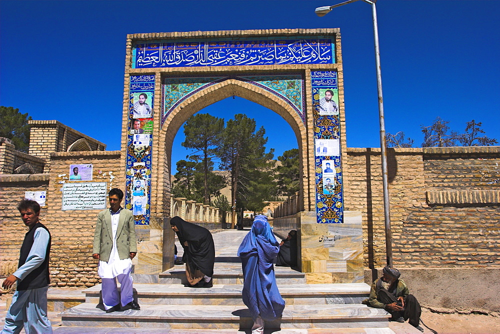 Pilgrims at main entrance arch, Sufi shrine of Gazargah, Herat, Herat Province, Afghanistan, Asia