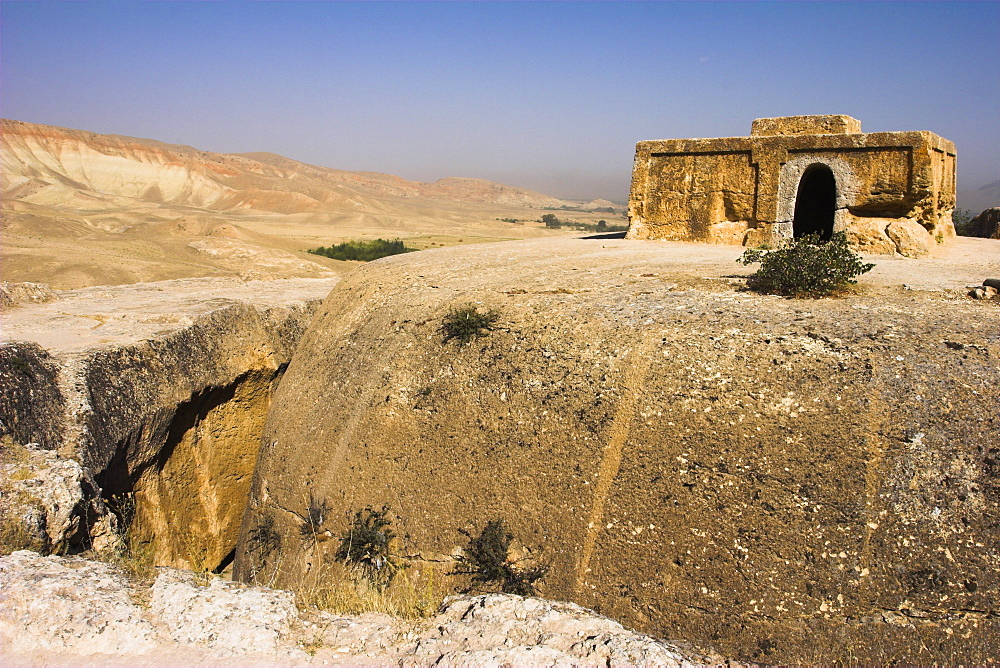 Buddhist stupa carved out of rock at Takht-I-Rustam (Rustam's throne) an early burial mound that contained relics of the Buddha, part of a stupa-monastery complex dating from the Kushano-Sasanian period 4th-5th century AD, near Haibak,Samangan Province, Afghanistan, Asia