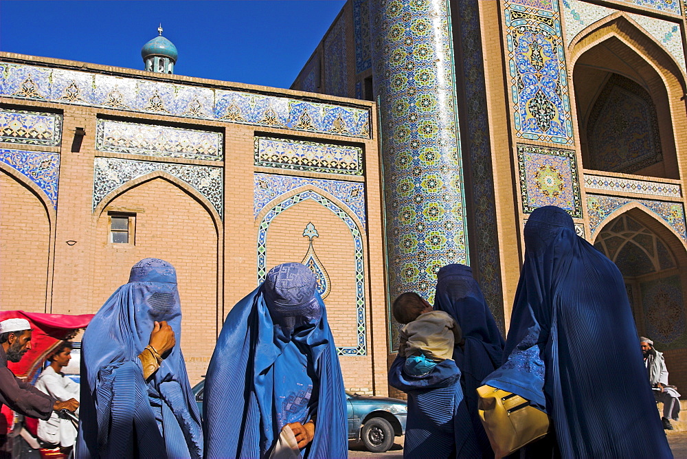 Ladies wearing blue burqas outside the Friday Mosque (Masjet-e Jam), Herat, Afghanistan, Asia