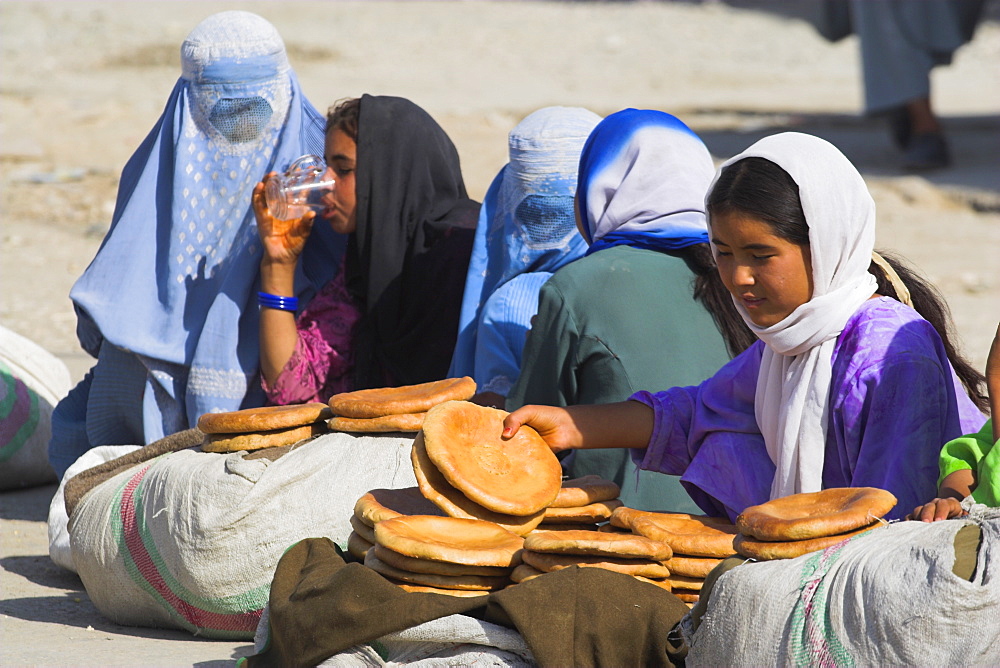 Girls selling bread on the street, Mazar-I-Sharif, Afghanistan, Asia