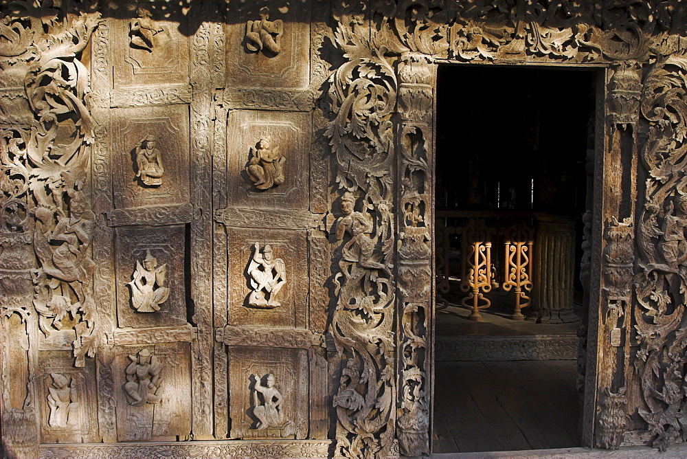 Carvings on traditional wooden monastery, once part of the Royal Palace complex, used as an apartment by King Mindon, Shwenandaw Kyaung (Golden Palace Monastery), Mandalay, Myanmar (Burma), Asia