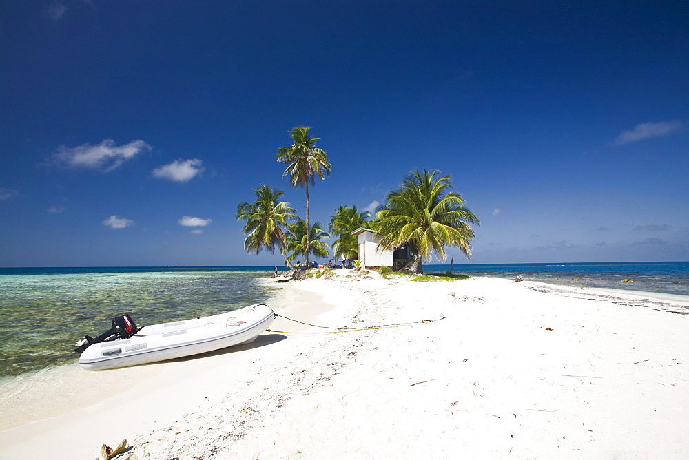 Dinghy on beach, Silk Caye, Belize, Central America