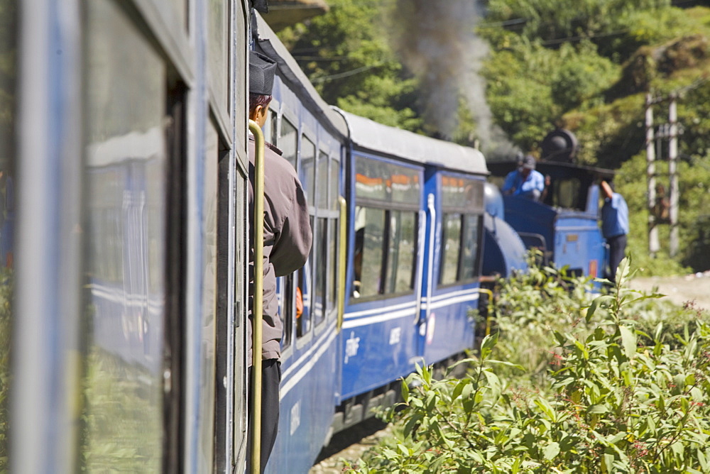 Steam train known as the Toy Train of the Darjeeling Himalayan Railway, UNESCO World Heritage Site, en route from Darjeeling to Ghoom, Darjeeling, West Bengal, India, Asia