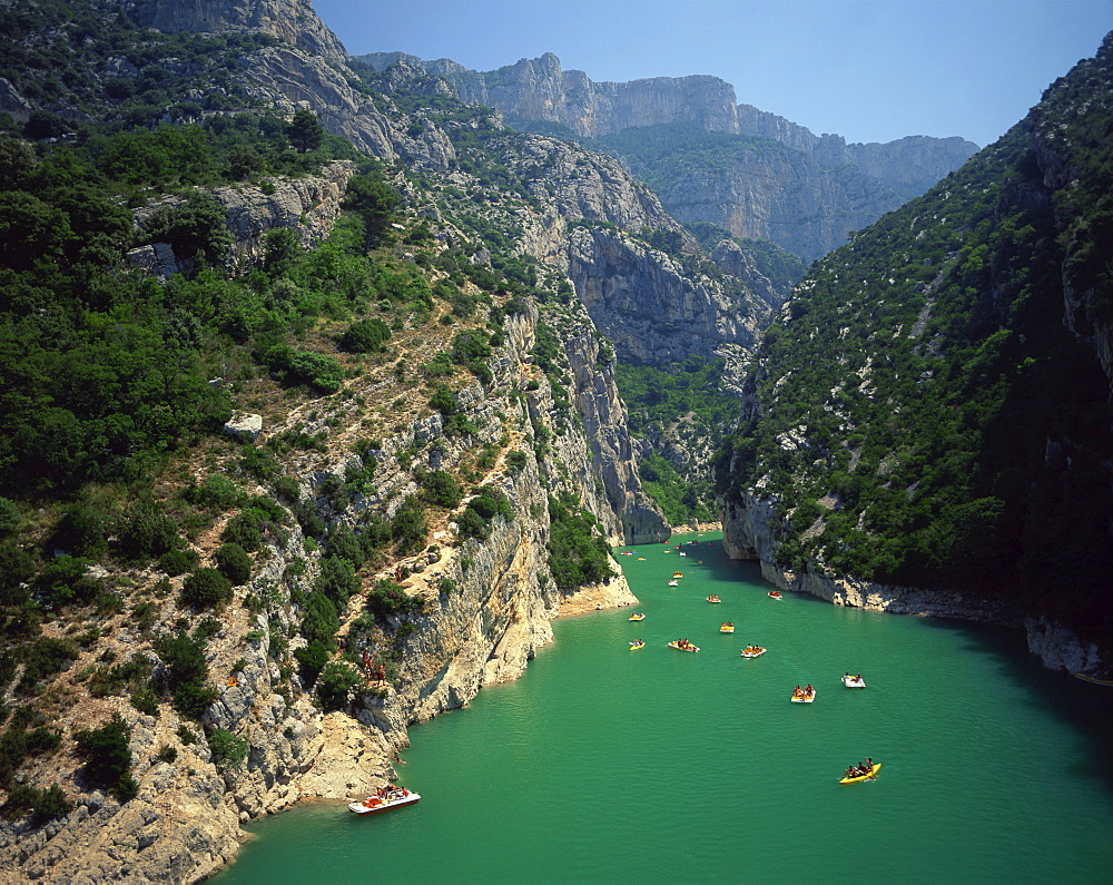 Canoes and pedalos on the River Verdon in the Grand Canyon du Verdon near Lac de Ste Croix, in the Alpes de Haute Provence, Provence, France, Europe