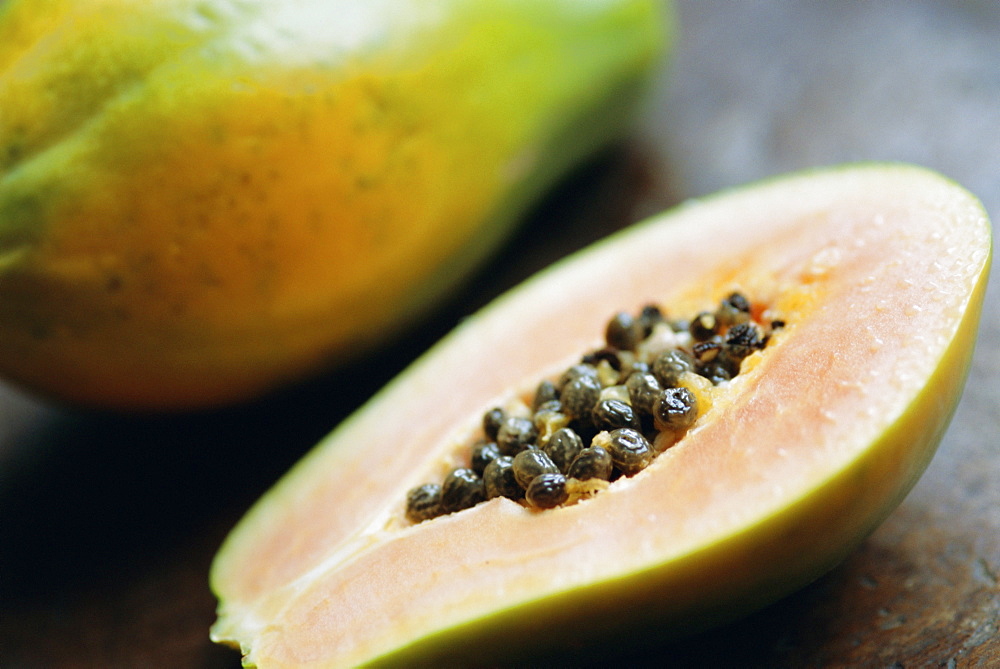 Papaya (pawpaw) sliced open to show black seeds