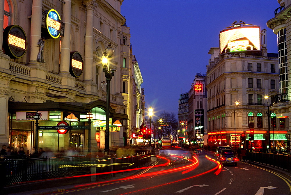 Traffic trails and theatre signs at night near Piccadilly Circus, London, England, United Kingdom, Europe