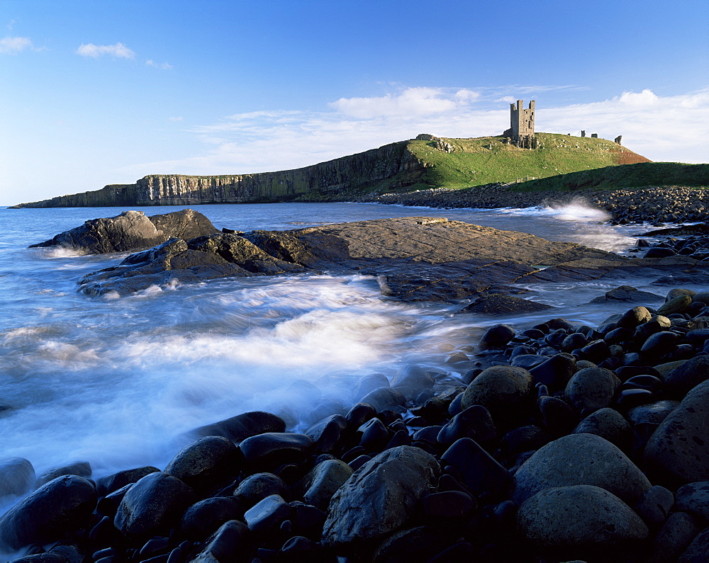 Dunstanburgh Castle, a National Trust property, from Embleton Bay, Northumberland, England, United Kingdom, Europe