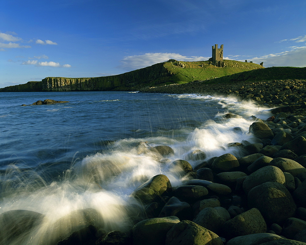 View across Embleton Bay towards Dunstanburgh Castle, Northumberland, England, United Kingdom, Europe