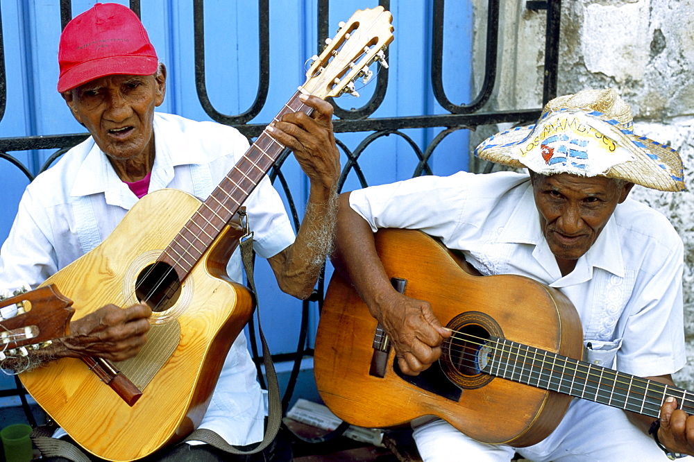 Musicians playing guitars, Havana Viejo, Havana, Cuba, West Indies, Central America