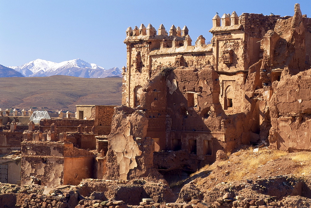 Ruins of Glaoui kasbah at Telouet, with the High Atlas mountains in the distance, Telouet, near Ouarzazate, Morocco, North Africa, Africa