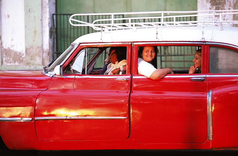 Women waiting in taxi in the early morning, Havana, Cuba, West Indies, Central America