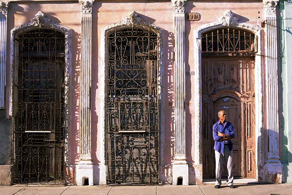 Building facades in evening light, Cienfuegos, Cuba, West Indies, Central America