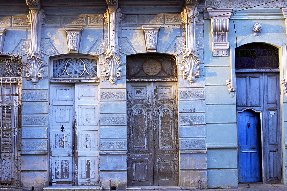 Building facades in evening light, Cienfuegos, Cuba, West Indies, Central America