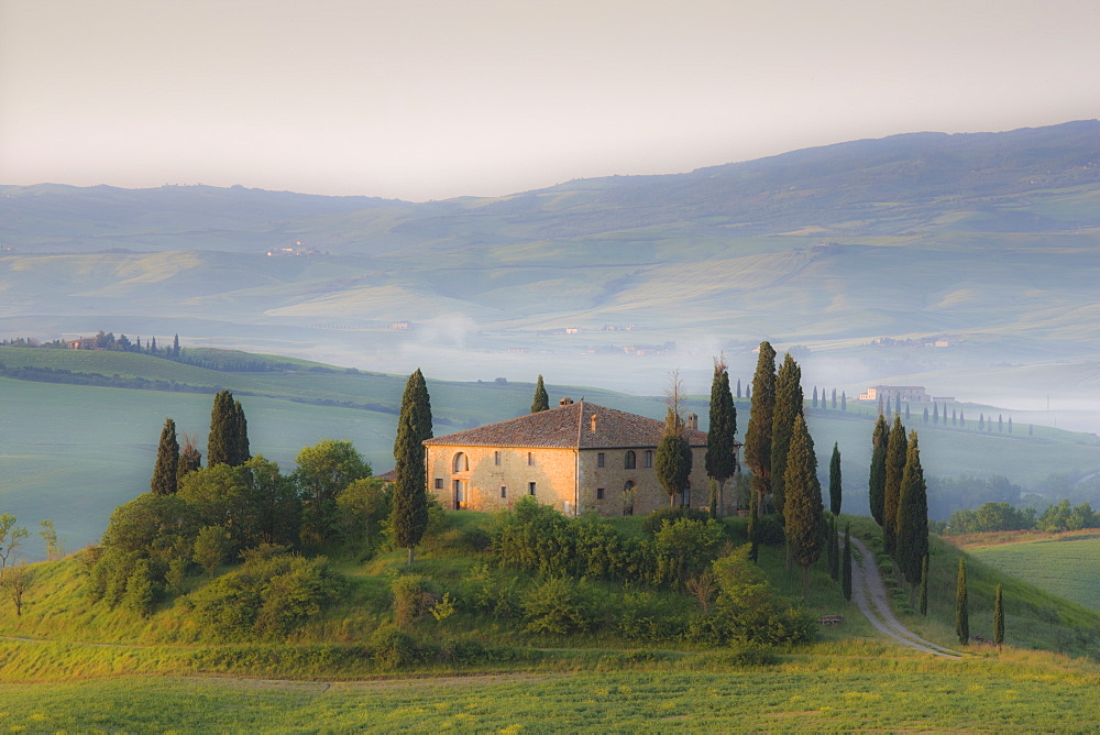 Misty dawn view towards Belvedere across Val d'Orcia, UNESCO World Heritage Site, San Quirico d'Orcia, near Pienza, Tuscany, Italy, Europe