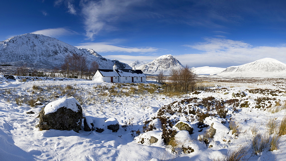 Panoramic view of Black Rock Cottage with Buachaille Etive Mor in distance on snow covered Rannoch Moor, near Fort William, Highland, Scotland, United Kingdom, Europe