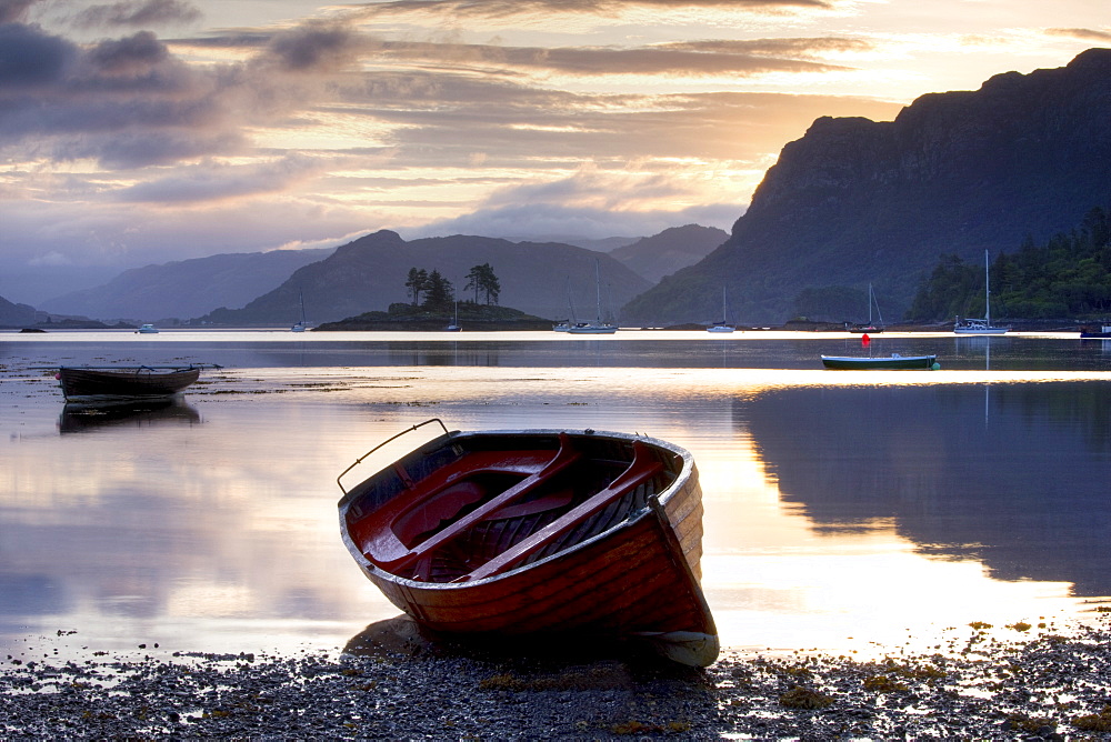 Dawn view at low tide with rowing boat in foreground, Plokton, near Kyle of Lochalsh, Highland, Scotland, United Kingdom, Europe