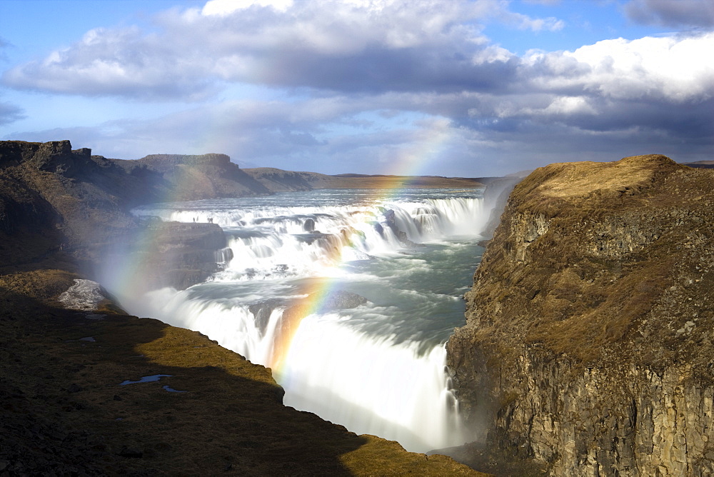 Gullfoss, Europe's biggest waterfall, with rainbow created by spray from the falls, near Reykjavik, Iceland, Polar Regions