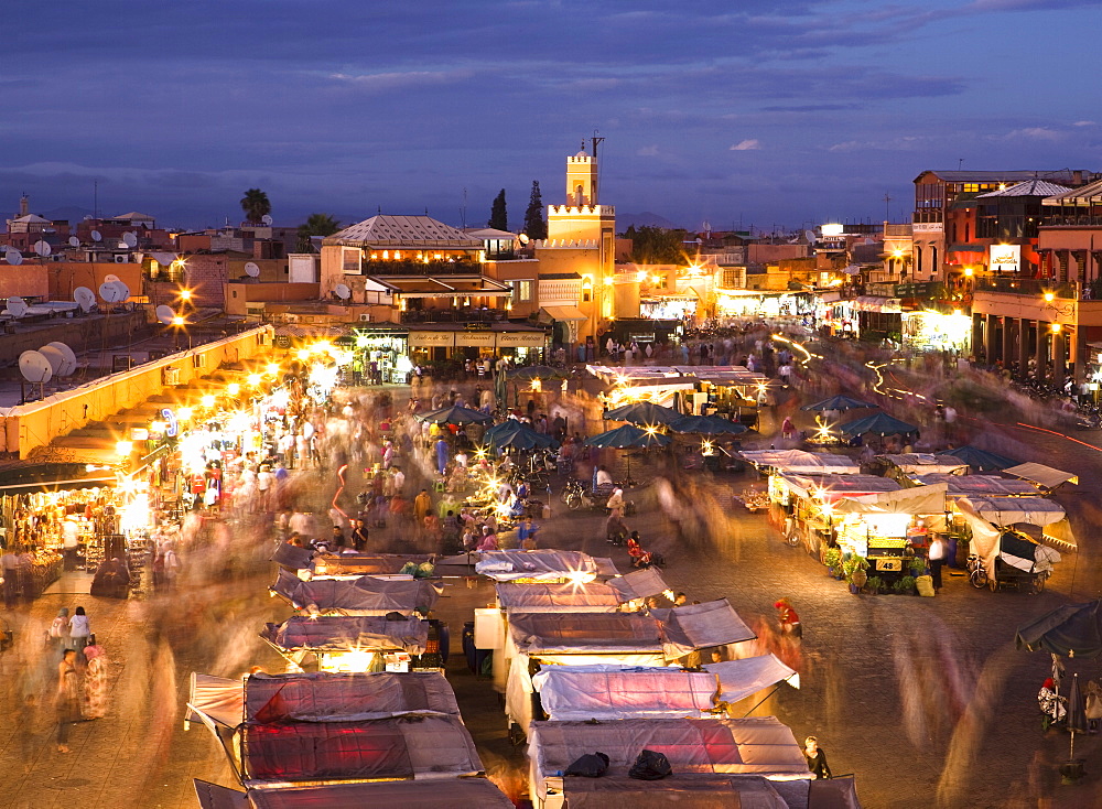 View over Djemaa el Fna at dusk with foodstalls and crowds of people, Marrakech, Morocco, North Africa, Africa