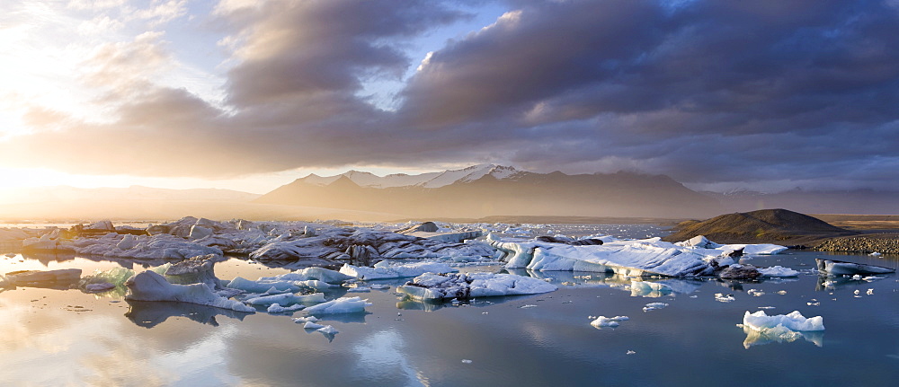 Icebergs floating on the Jokulsarlon glacial lagoon at sunset, Iceland, Polar Regions