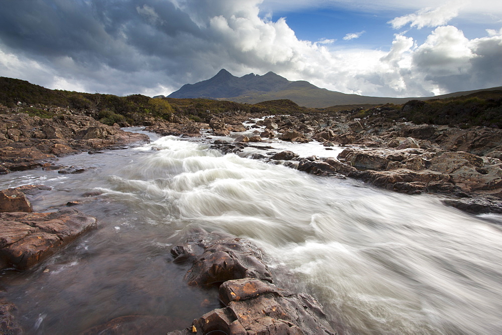 River Sligachan tumbling over rocks with Sgurr nan Gillean in distance, Glen Sligachan, Isle of Skye, Highlands, Scotland, United Kingdom, Europe