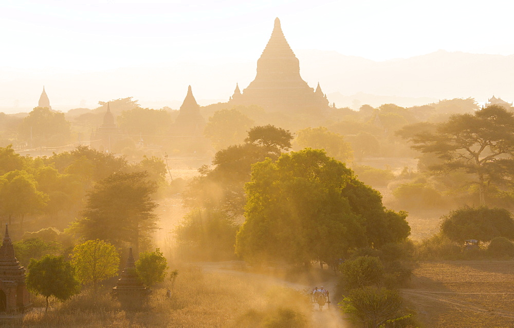 View over the temples of Bagan swathed in dust and evening sunlight, from Shwesandaw Paya, Bagan, Myanmar (Burma), Southeast Asia