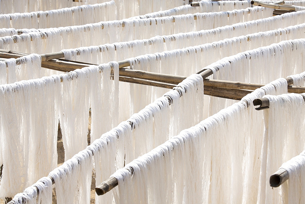 White silk drying in the sun on bamboo racks, Amarapura, near Mandalay, Myanmar (Burma), Southeast Asia