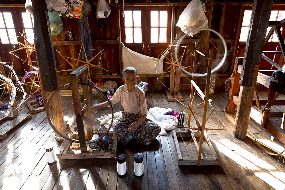 Woman spinning silk in factory in In Phaw Khone village, Inle Lake, Myanmar (Burma), Southeast Asia