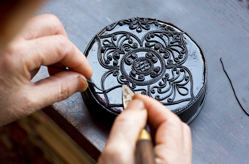 Black Kengtung style lacquerware being made at U Mu Ling Ta, a fifth-generation shop specialising in lacquerware in Kengtung (Kyaingtong), Shan State, Myanmar (Burma), Asia