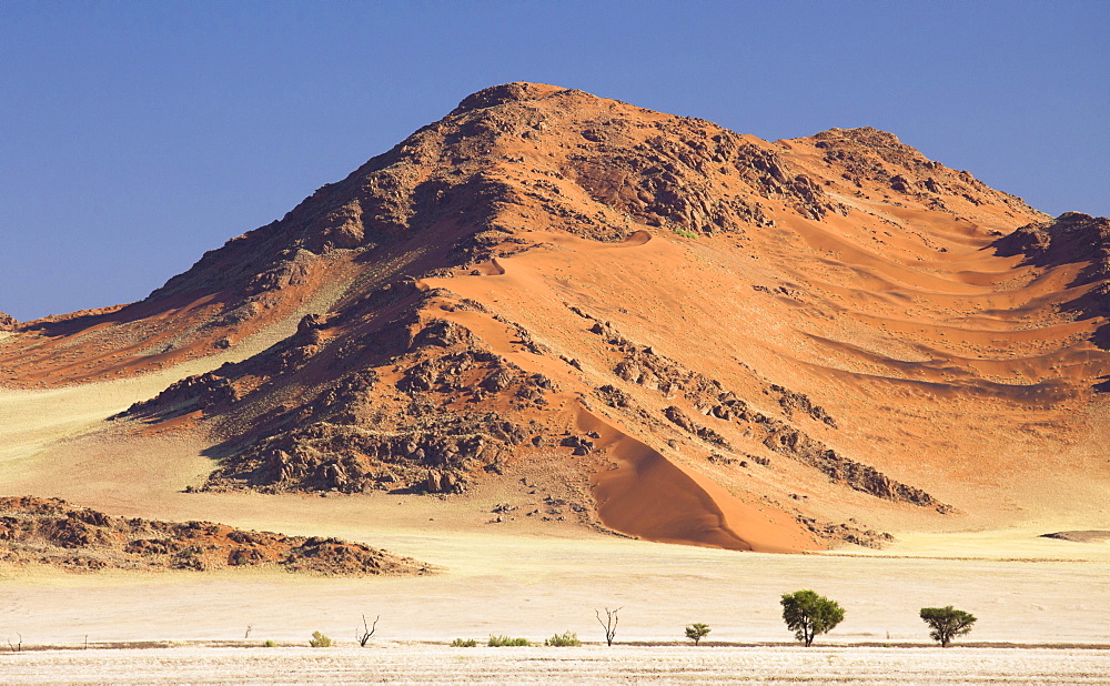 Towering sandstone mountains and dunes in the ancient Namib Desert near Sesriem, Namib Naukluft Park, Namibia, Africa