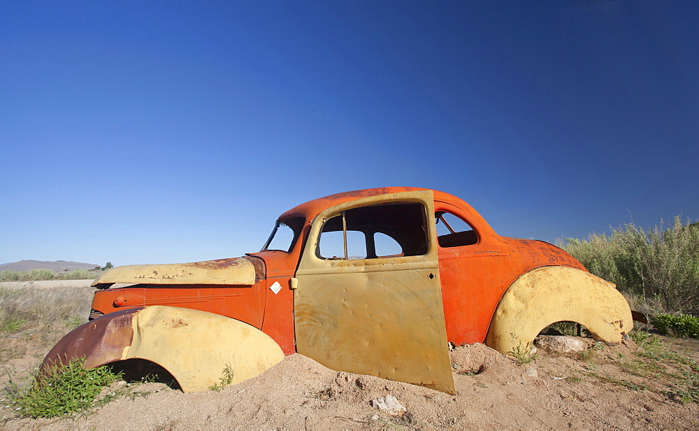 Old abandoned car outside the service station at Solitaire, a lonely outpost near Sesriem, Namib Naukluft Park, Namibia, Africa