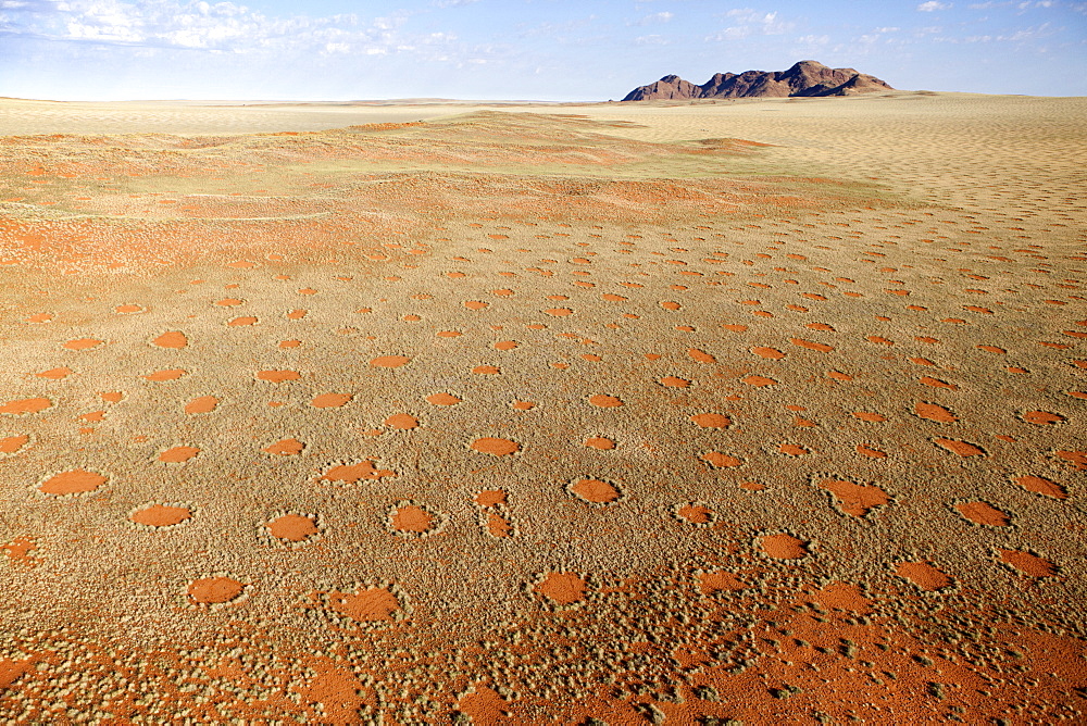 Aerial view from hot air balloon over magnificent desert landscape covered in 'Fairy Circles', Namib Rand game reserve Namib Naukluft Park, Namibia, Africa