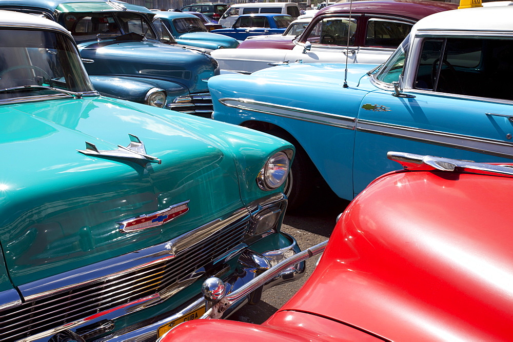 Vintage American cars parked on a street in Havana Centro, Havana, Cuba, West Indies, Central America