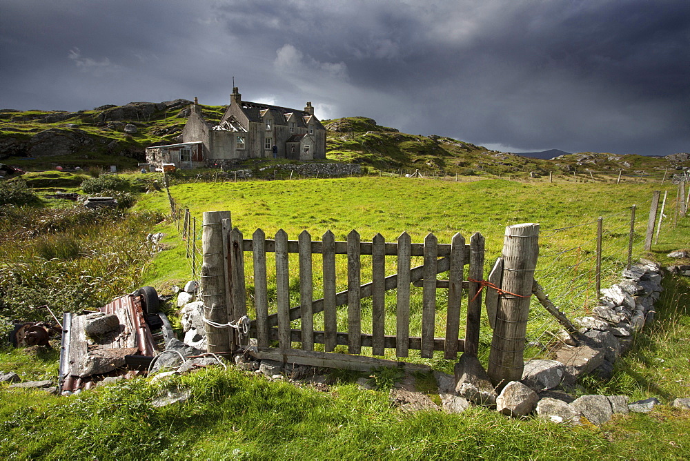 Abandoned croft beneath a stormy sky in the township of Manish on the east coast of The Isle of Harris, Outer Hebrides, Scotland