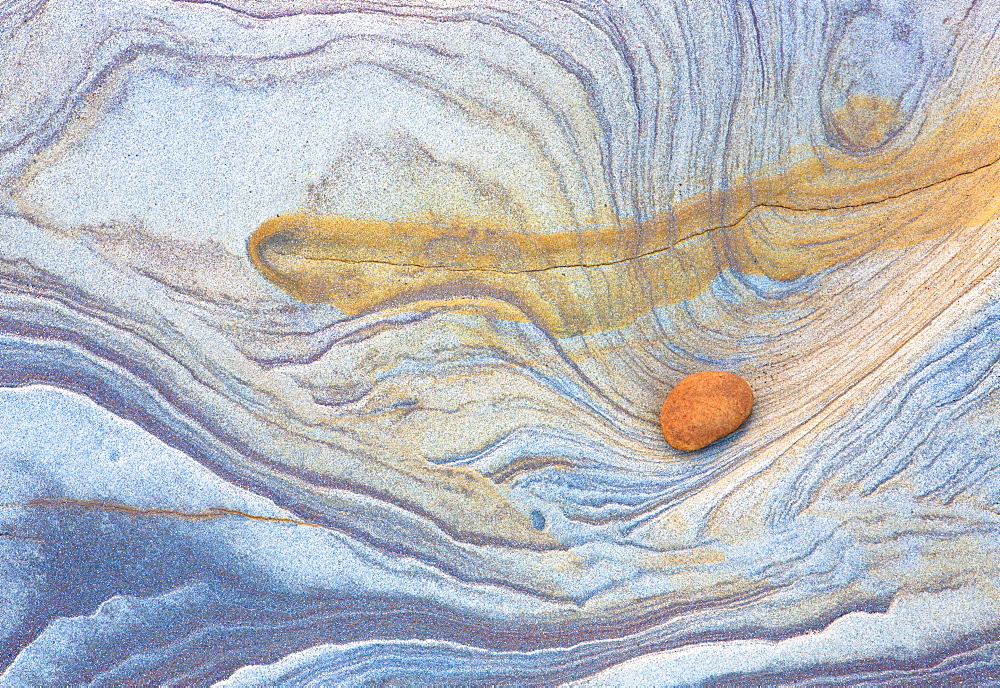 Colourful patterns created by sea erosion on rocks revealed at low tide on Spittal Beach, Berwick-upon-Tweed, Northumberland on border between England and Scotland, United Kingdom, Europe