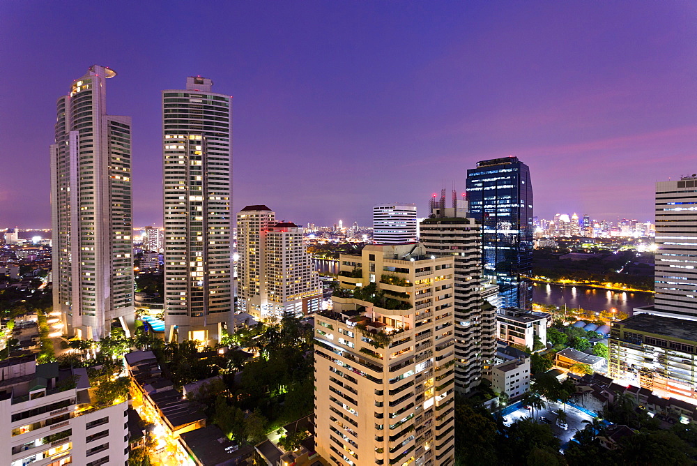 High rise buildings of Bangkok at night from Rembrandt Hotel and Towers, Sukhumvit 18, Bangkok, Thailand, Southeast Asia, Asia