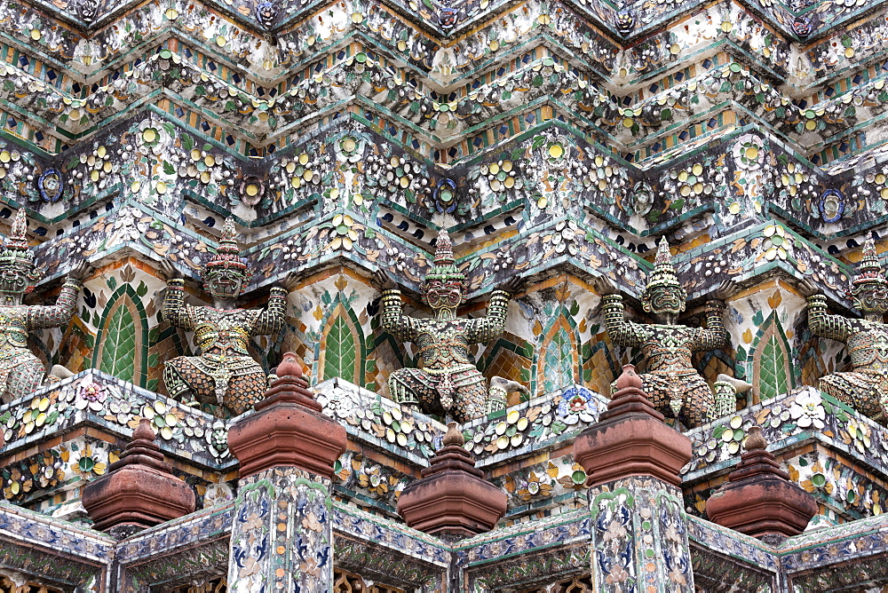 Detail of the Central Prang showing demon figures and ceramic decoration created using broken ceramics used as ballast in the 19th century on Chinese trading ships, Wat Arun, Bangkok, Thailand, Southeast Asia, Asia