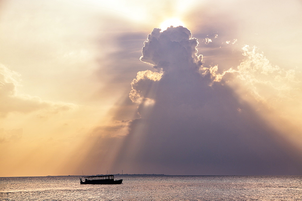 Dramatic cloud formations and boat in silhoutte at sunset, Dhuni Kolhu, Baa Atoll, Republic of Maldives, Indian Ocean, Asia