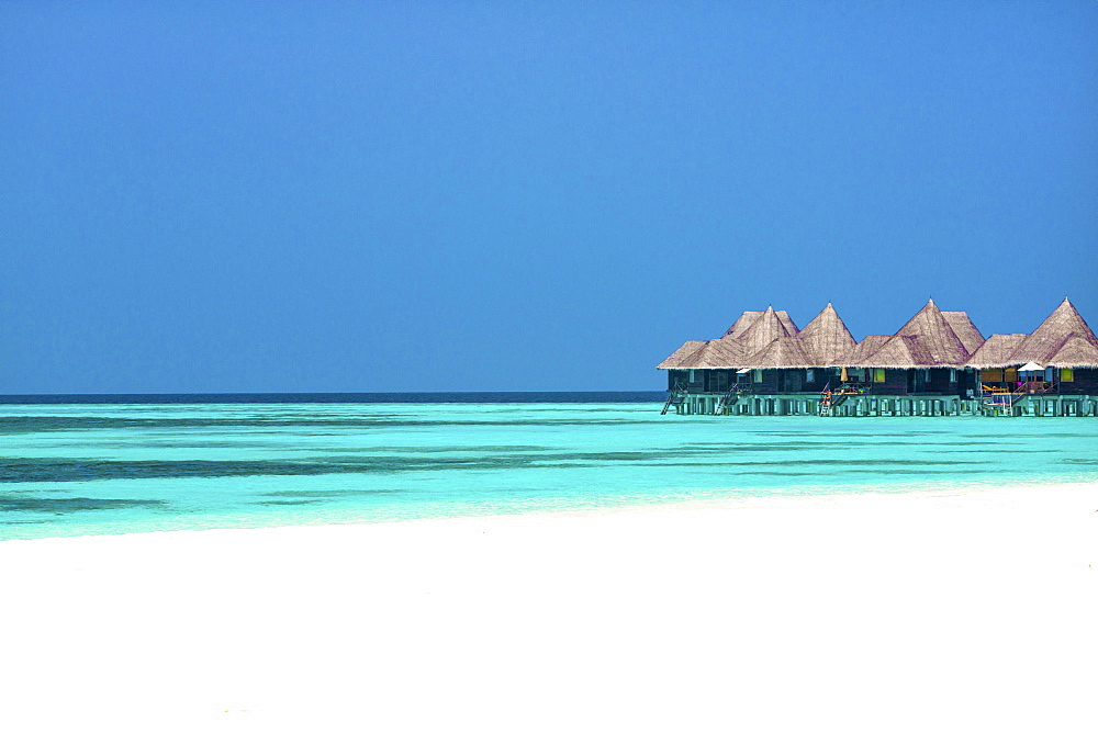 Tropical beach and over-water villas, Coco Palm, Dhuni Kolhu, Baa Atoll, Republic of Maldives, Indian Ocean, Asia