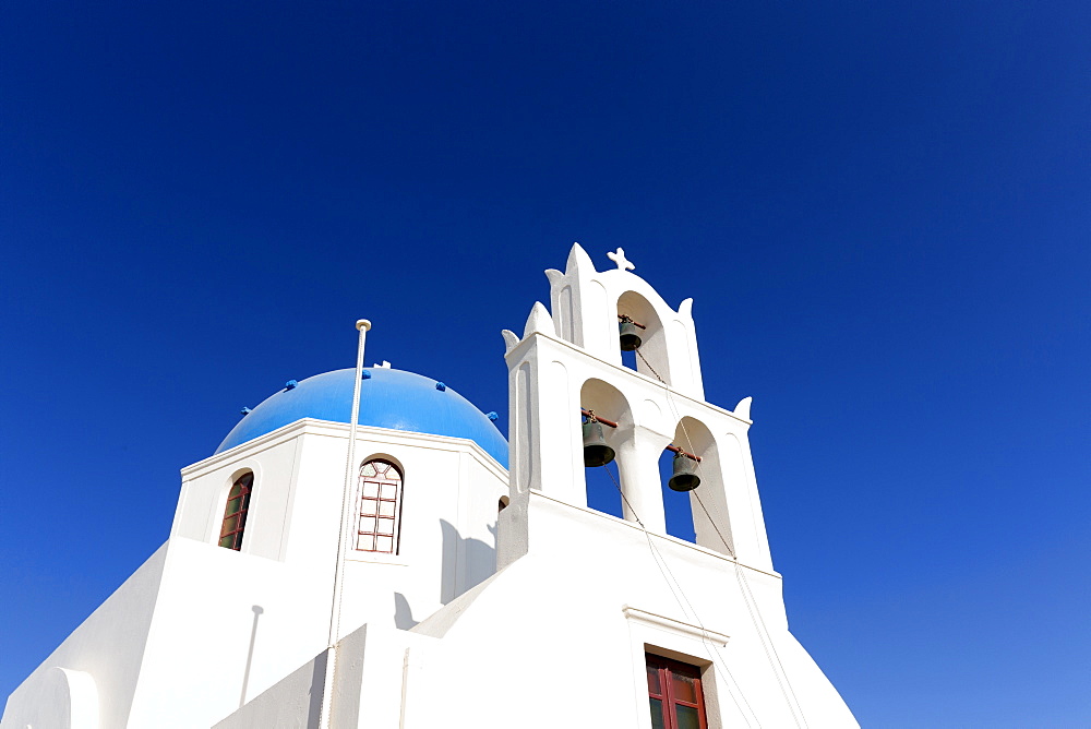 Classic Greek Orthodox church with blue dome, Oia, Santorini, Cyclades, Greek Islands, Greece, Europe