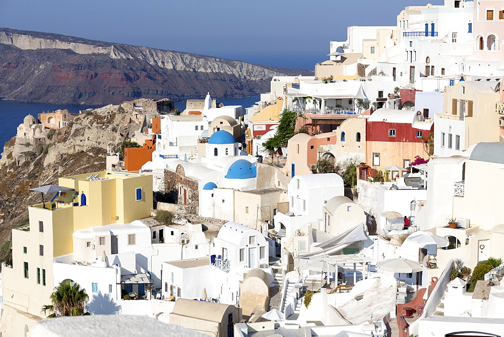 Classic view of the village of Oia with its blue domed churches and colourful houses, Oia, Santorini, Cyclades, Greek Islands, Greece, Europe