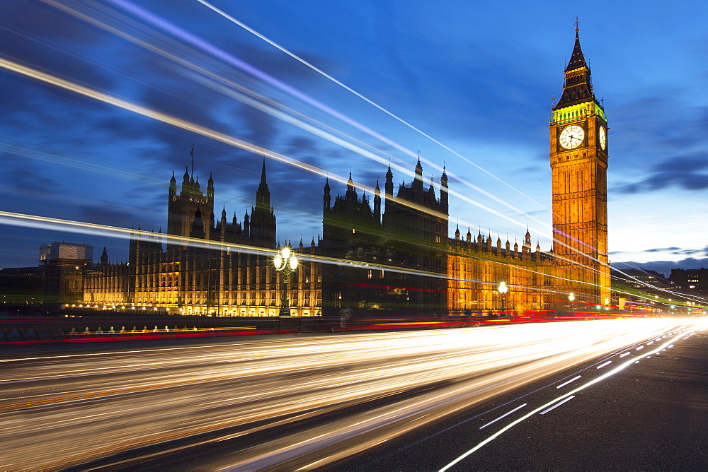 Big Ben and The Houses of Parliament at night with traffic trails on Westminster Bridge, London, England, United Kingdom, Europe