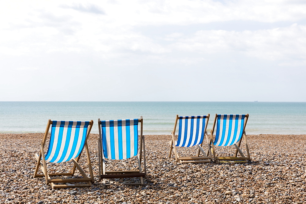 Deckchairs on the beach, Brighton, East Sussex, England, United Kingdom, Europe