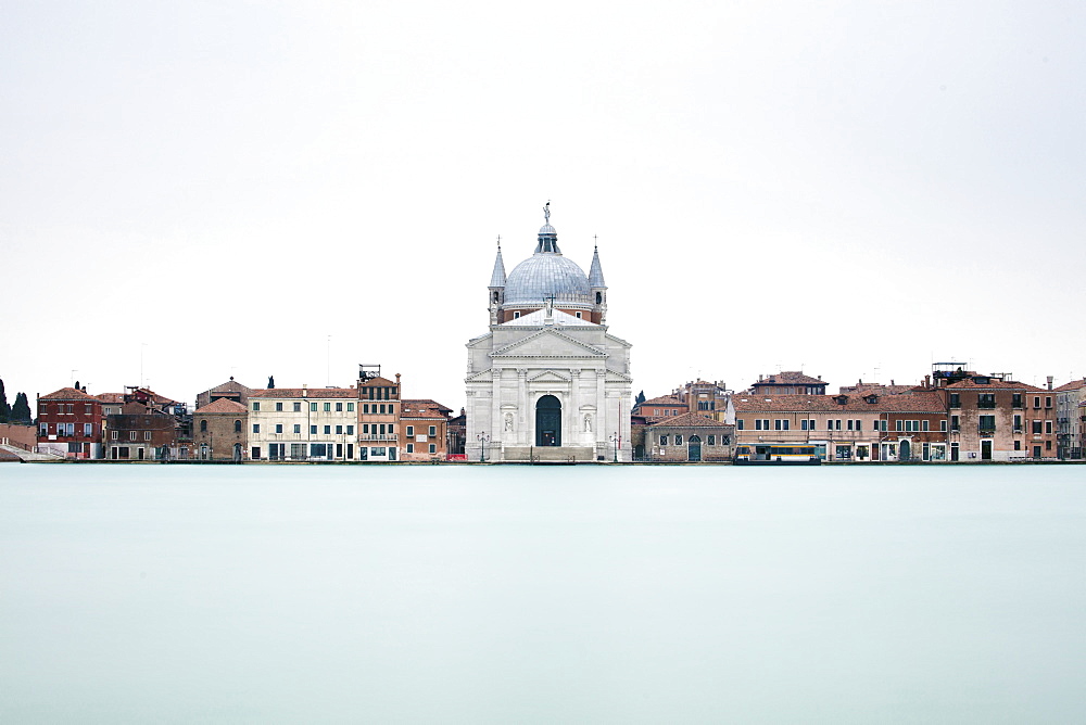 Long exposure image looking across Canale Della Giudecca towards Chiesa del Santissimo Redentore Giudecca, Venice, UNESCO World Heritage Site, Veneto, Italy, Europe