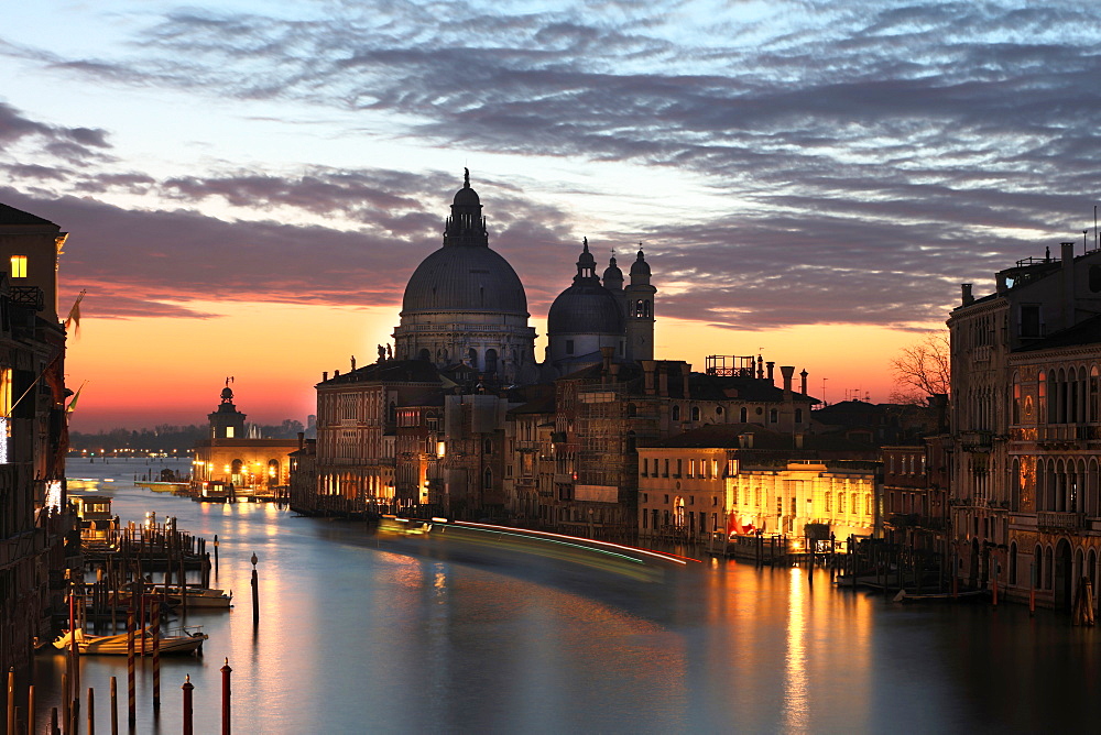 View along Grand Canal towards Santa Maria Della Salute from Accademia Bridge at dawn, Venice, UNESCO World Heritage Site, Veneto, Italy, Europe