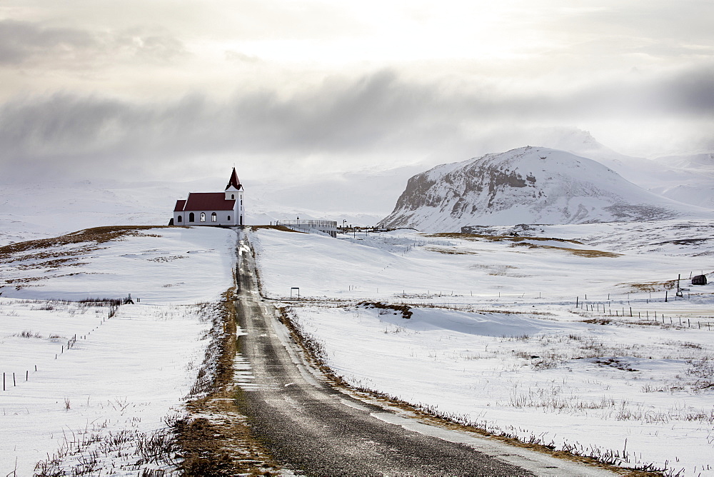 Isolated church (Ingjaldscholskirkja) in winter near Rif on the Snaefellsnes Peninsula, Iceland, Polar Regions