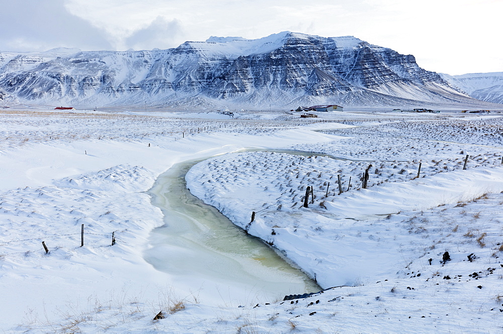 Stunning snow covered winter landscape bathed in afternoon sunlight, on the road to the Snaefellsnes Peninsula, Iceland, Polar Regions