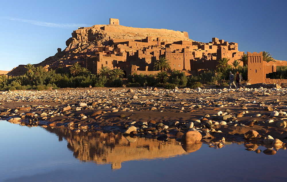 The ancient Kasbah Ait Benhaddou bathed in morning light and reflecting in river, UNESCO World Heritage Site, near Ouarzazate, Morocco, North Africa, Africa