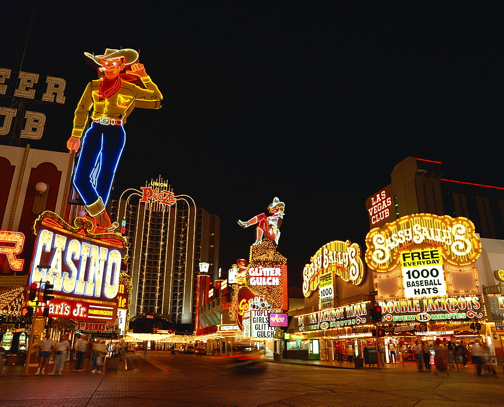 Neon signs at night on a street in Las Vegas, Nevada, United States of America, North America